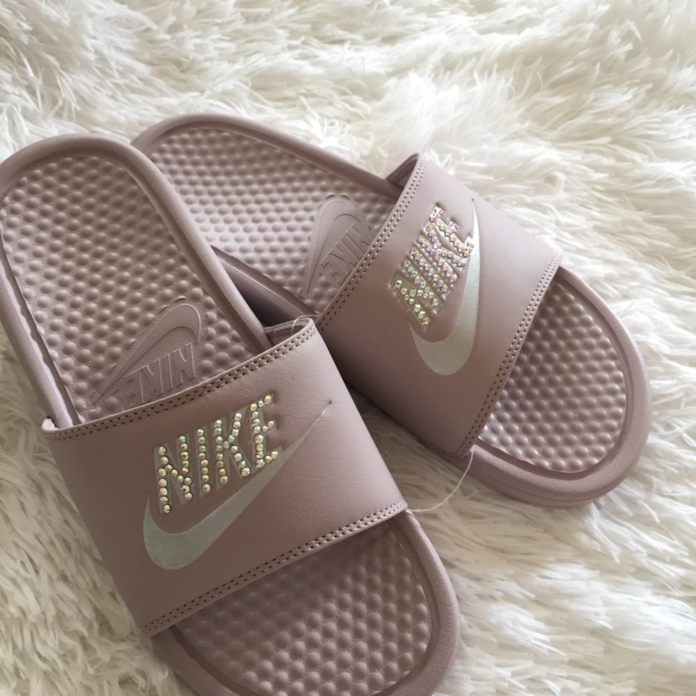 Pink Nike slides with studs